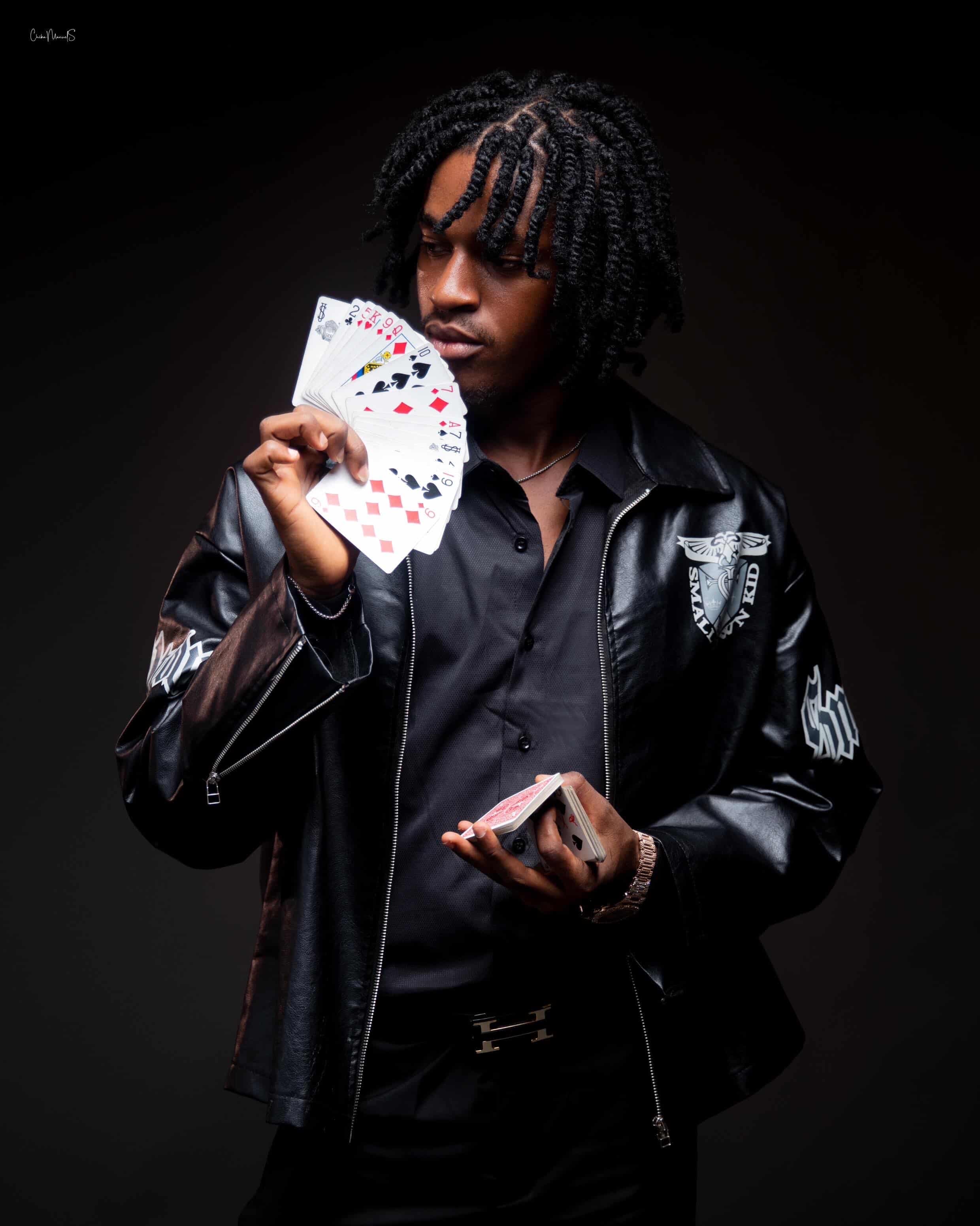 Caleb — studying a fan of playing cards