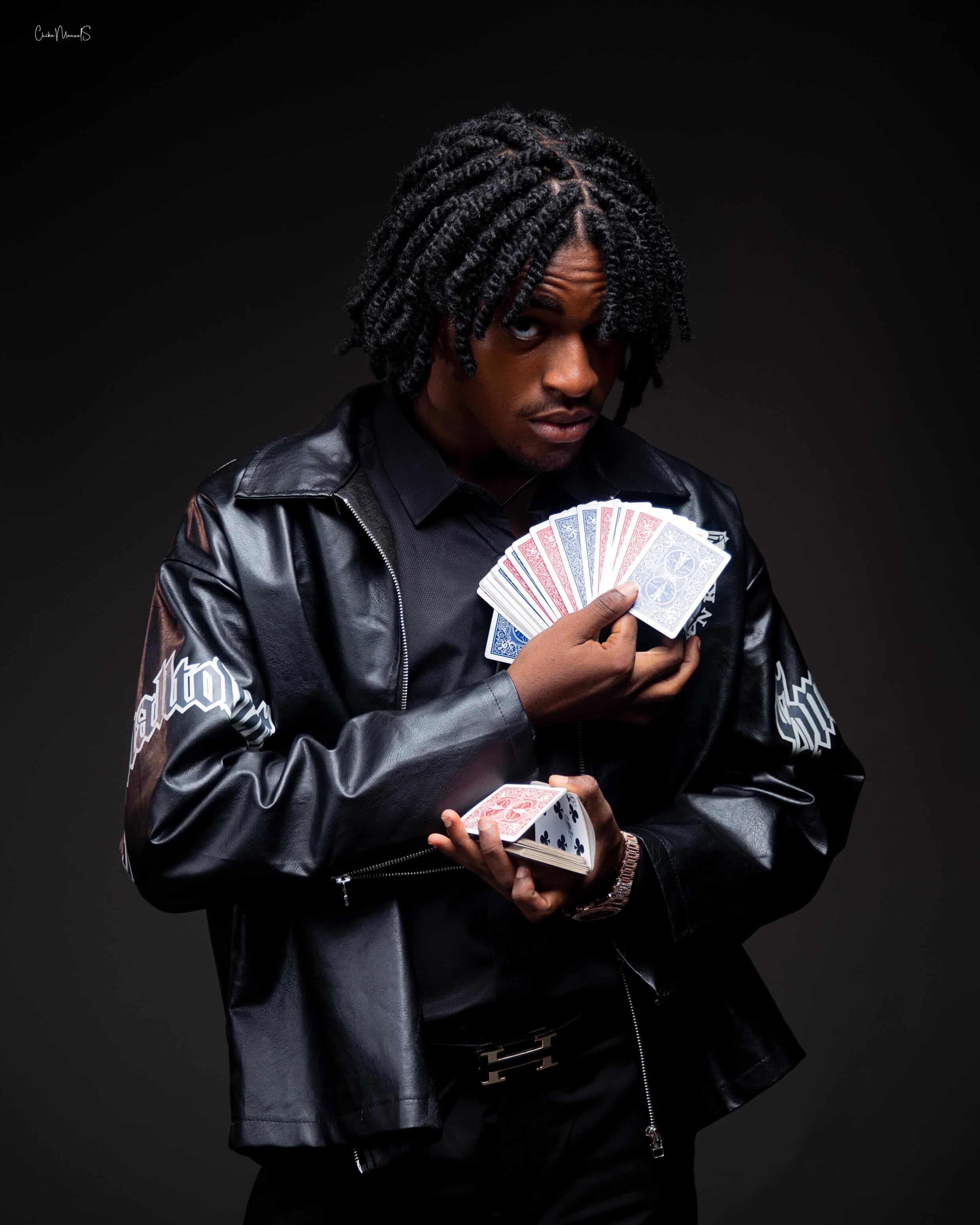 Caleb — holding a fan of red and blue card backs